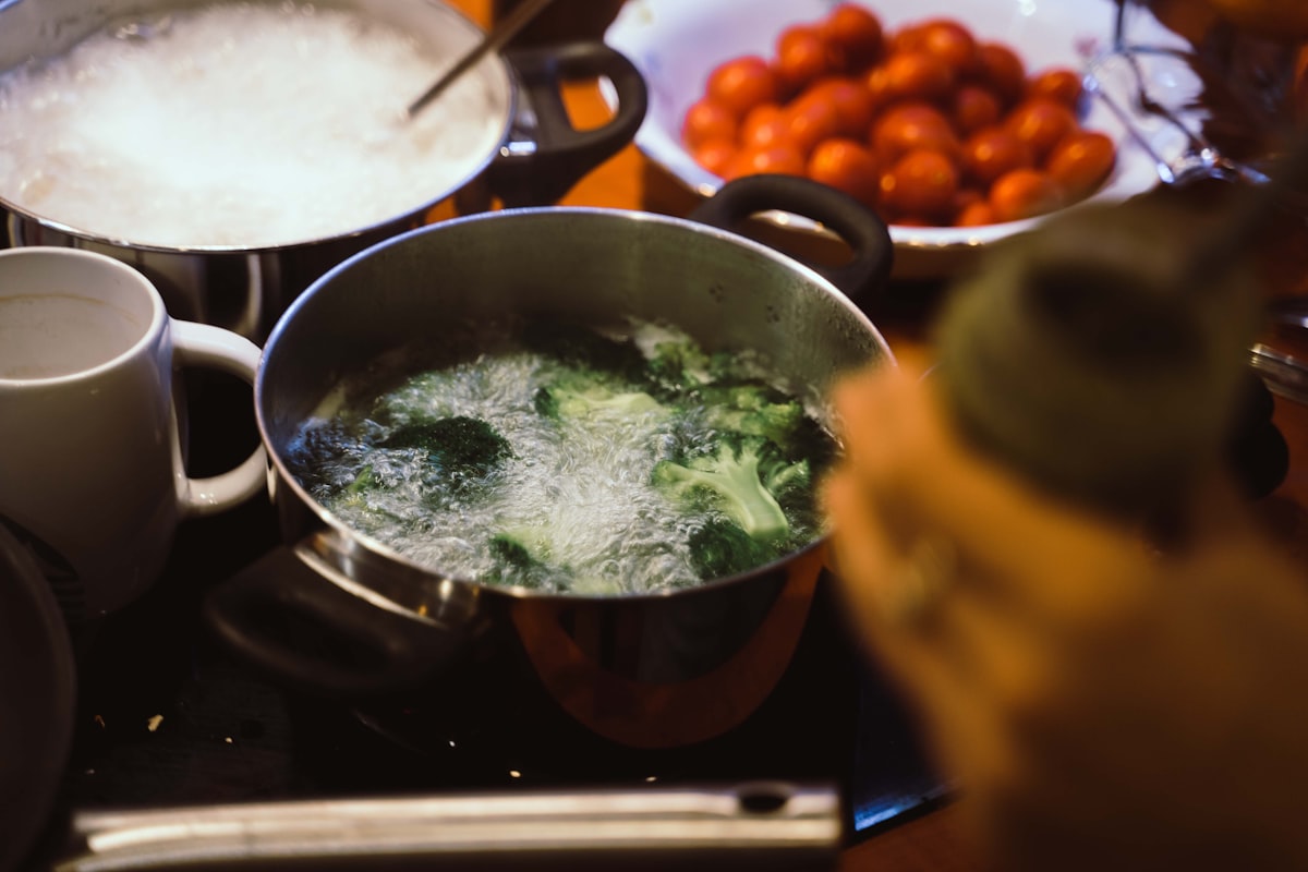 Fresh vegetables and cooking preparation demonstrating nutrient preservation